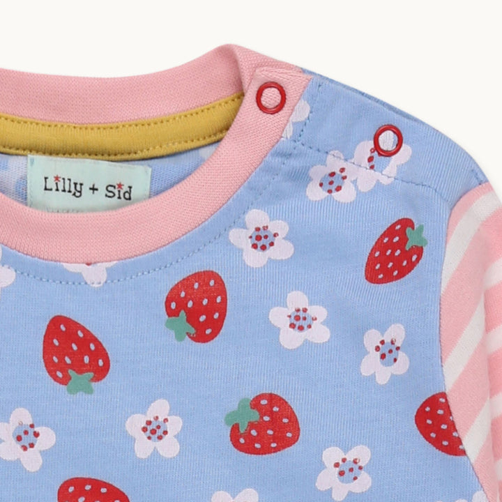 Organic cotton strawberry flower baby playsuit - closeup