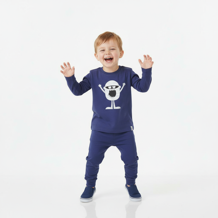 Child wearing a blue outfit with a white graphic on a white background