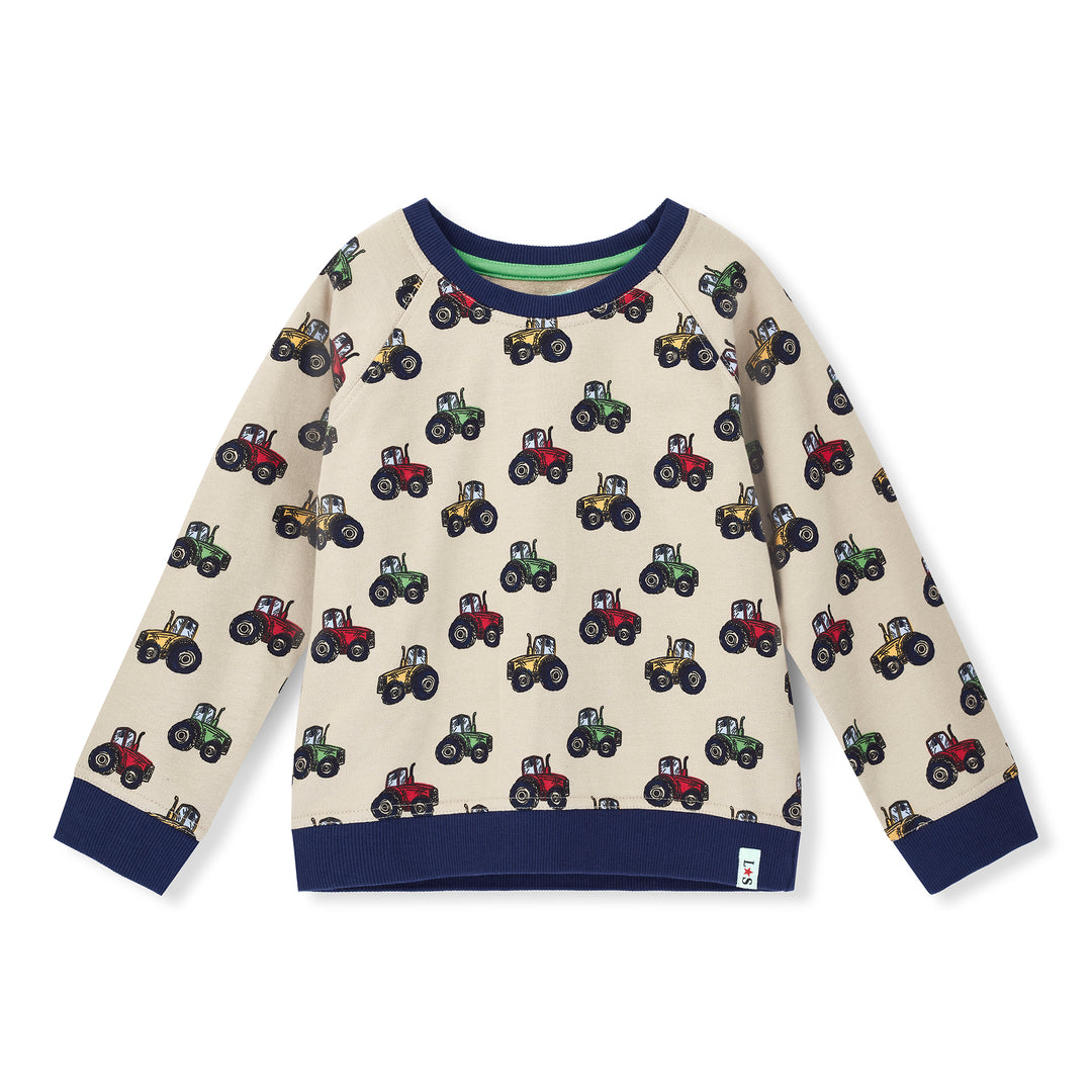 Children's sweater with tractor pattern on a white background