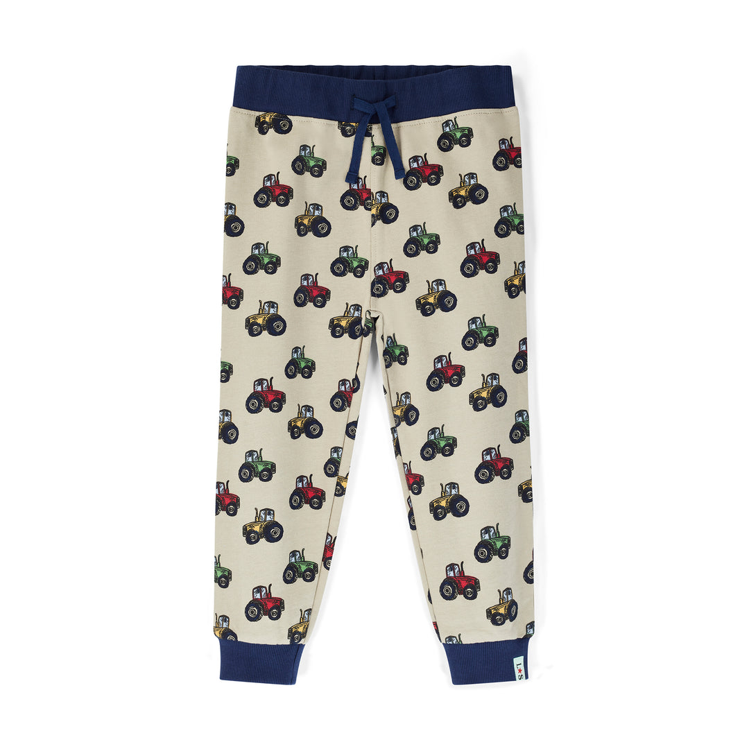 Children's pants with tractor pattern on a white background