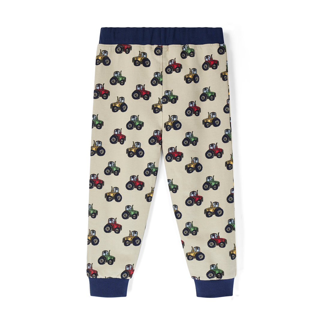 Children's pants with tractor pattern on a white background