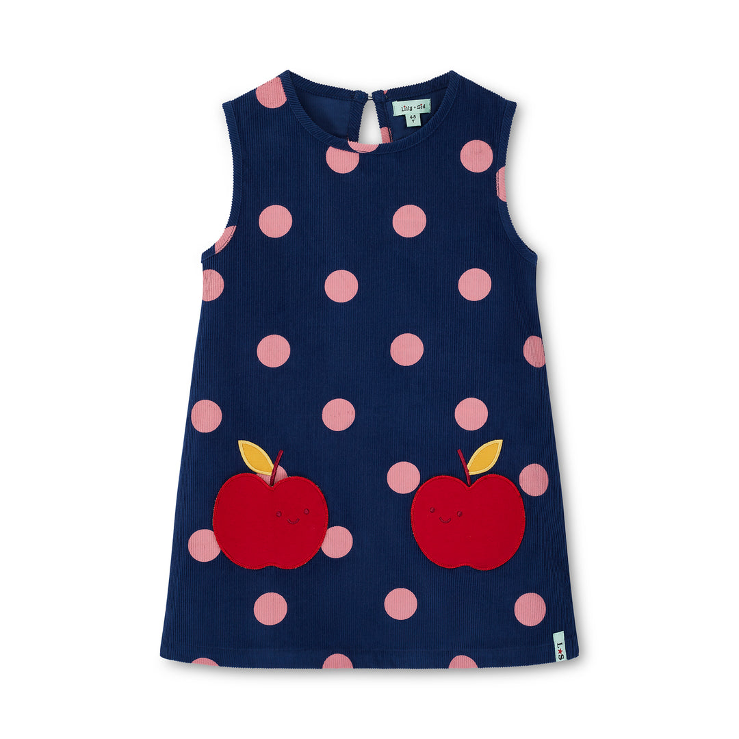 Navy dress with pink polka dots and red apples on a white background
