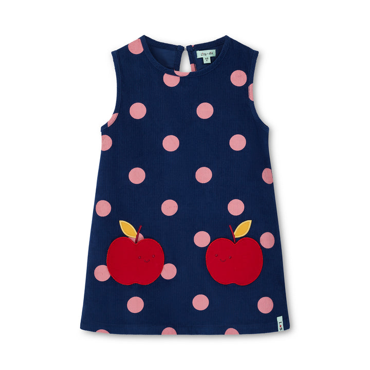 Navy dress with pink polka dots and red apples on a white background