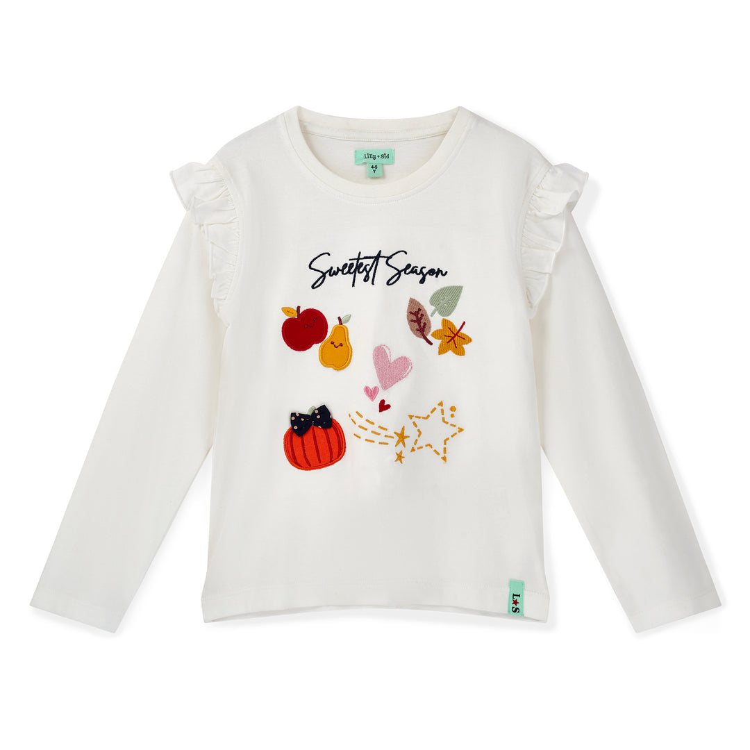 White long-sleeve shirt with autumn-themed graphics and text on a white background