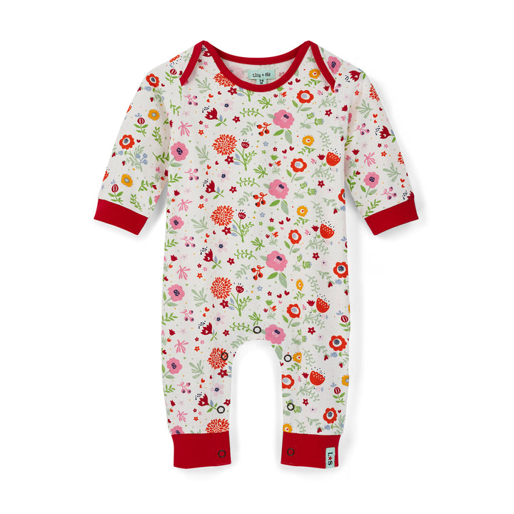 Floral-patterned baby onesie with red cuffs and trim on a white background
