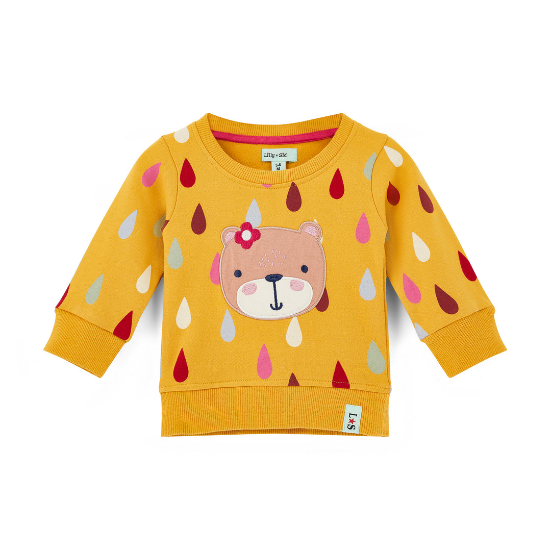 Yellow children's sweatshirt with bear face design on a white background