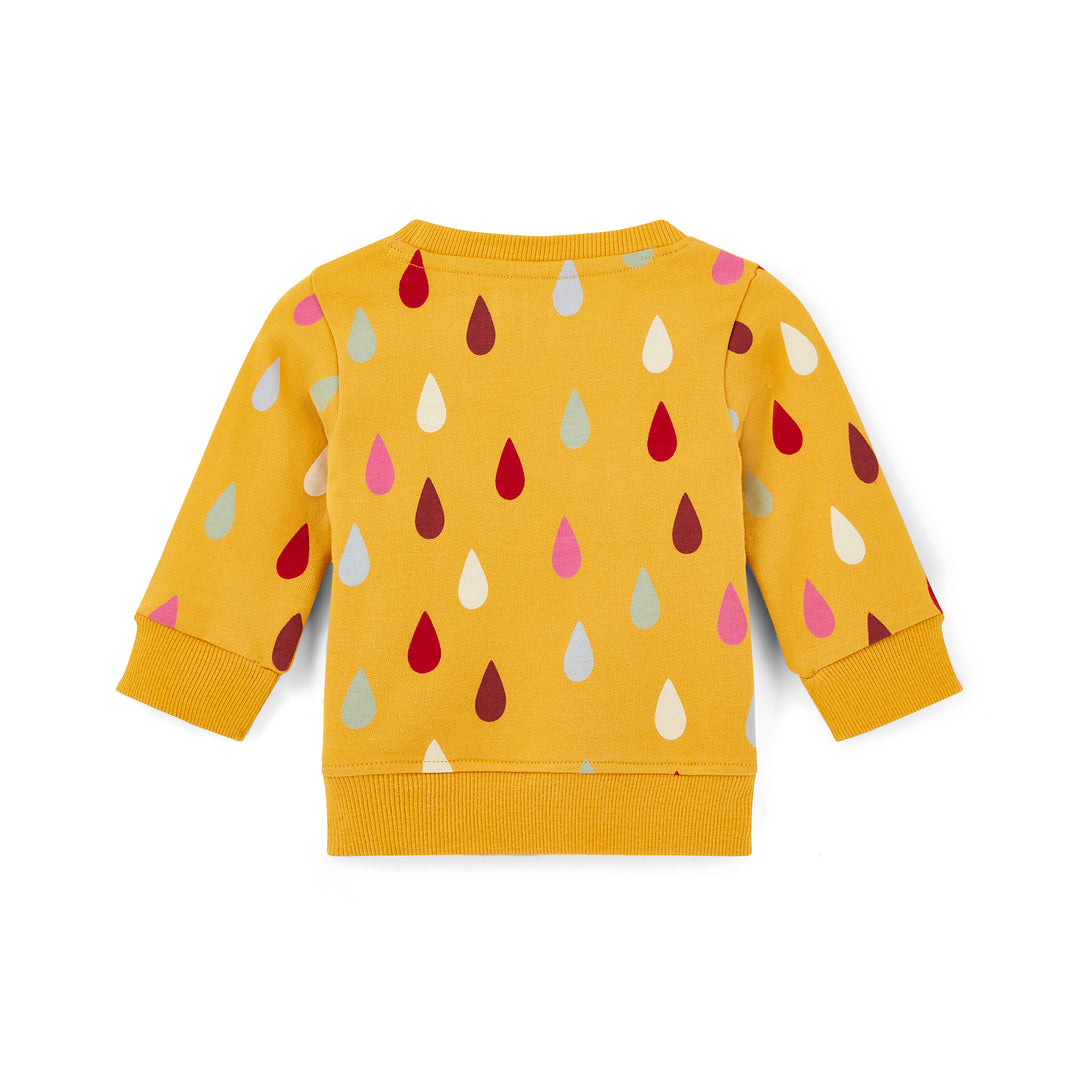 Yellow sweatshirt with colorful raindrop pattern on a white background