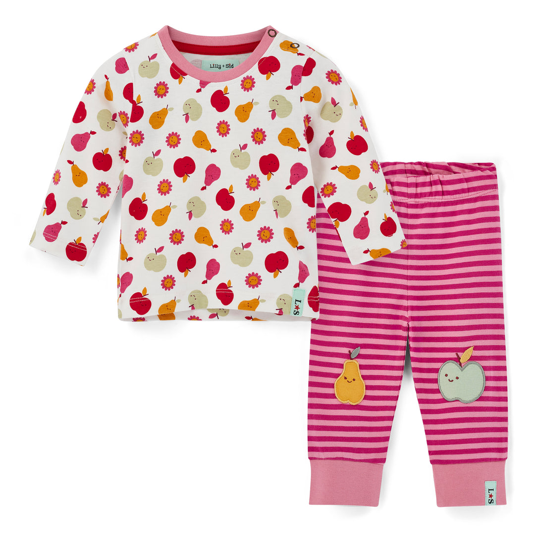 Children's pajama set with fruit pattern top and pink striped pants on a white background