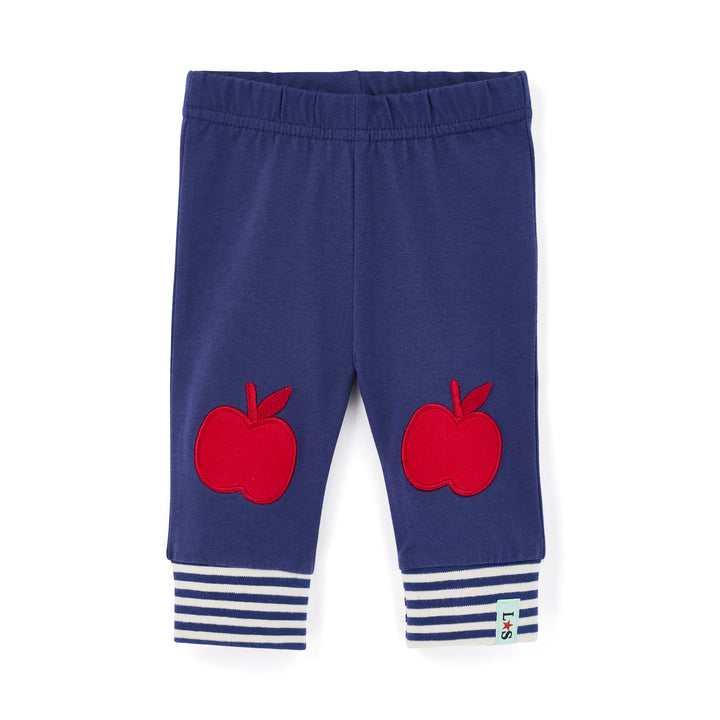 Blue children's leggings with red apple designs and striped cuffs on a white background