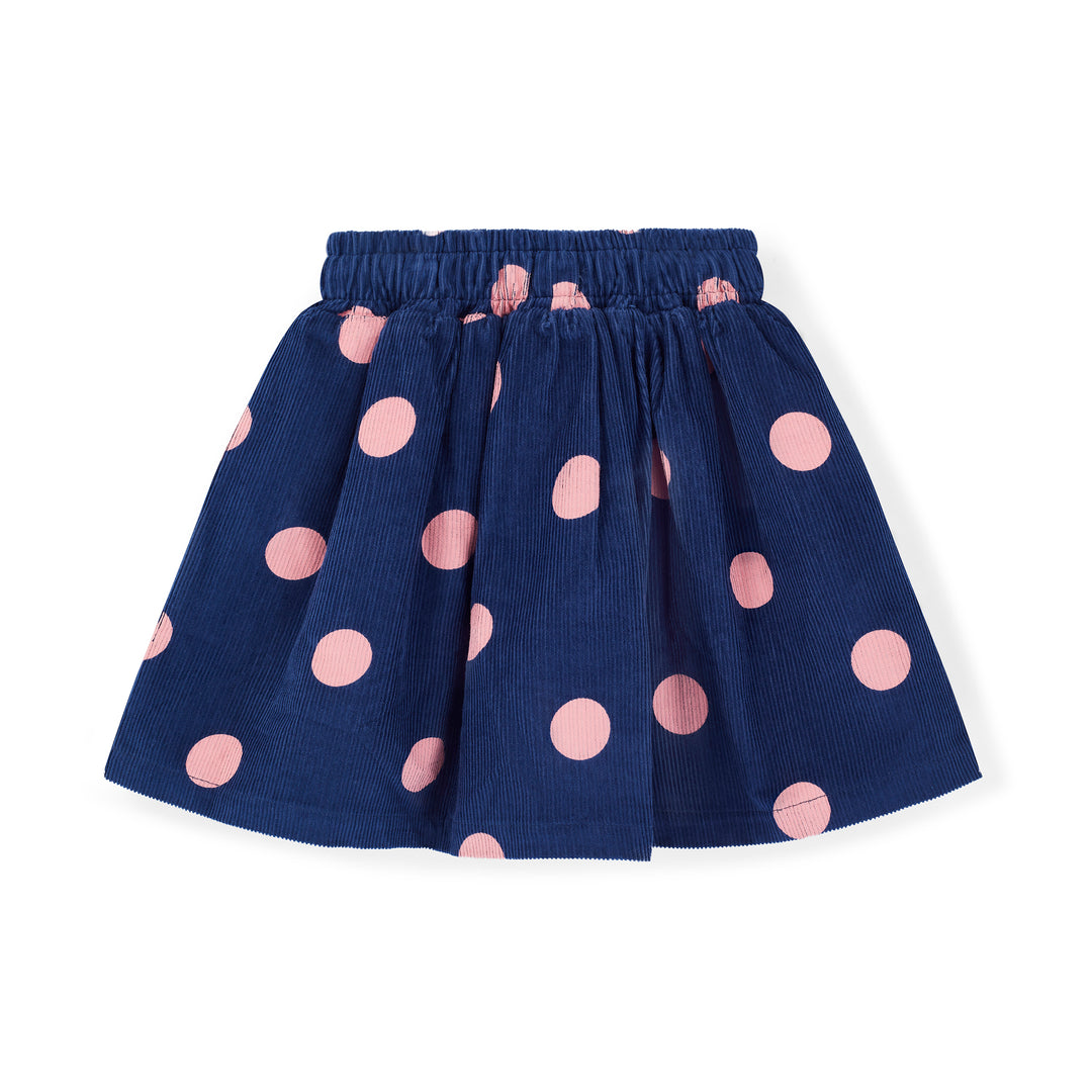 Navy blue skirt with pink polka dots on a white background