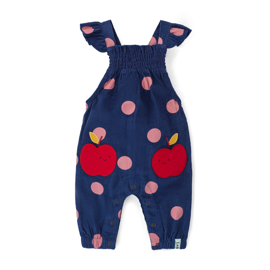 Navy blue baby romper with red apple and pink polka dot pattern on a white background