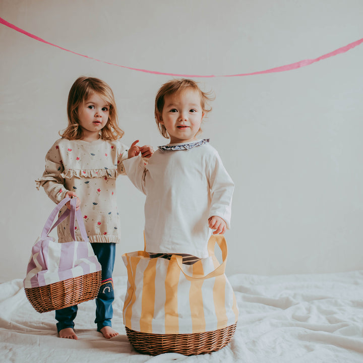 Girl wearing organic cotton kids top two pack.