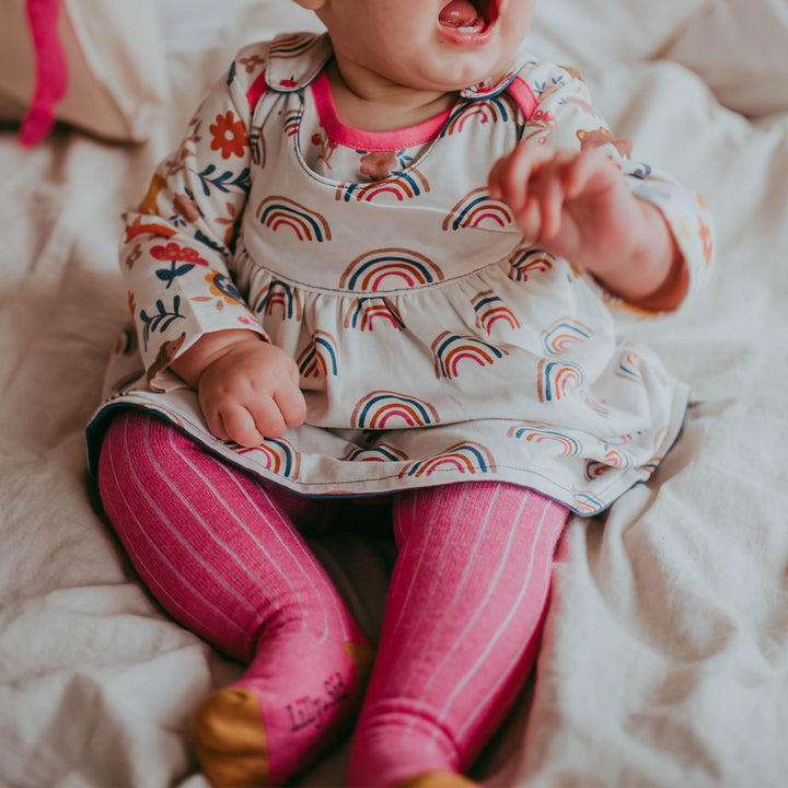 Baby girl wearing organic girls pink rib tights