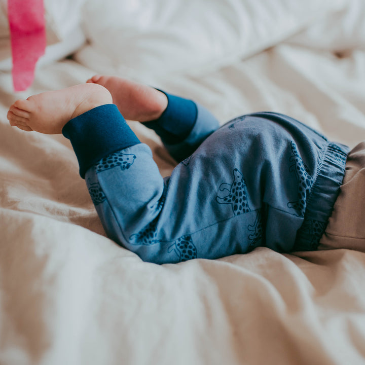 Baby boy wearing organic cotton sustainable baby leggings