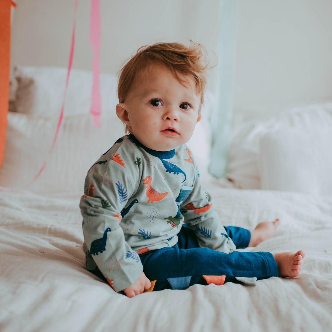 Baby boy wearing sustainable organic cotton top and trousers set