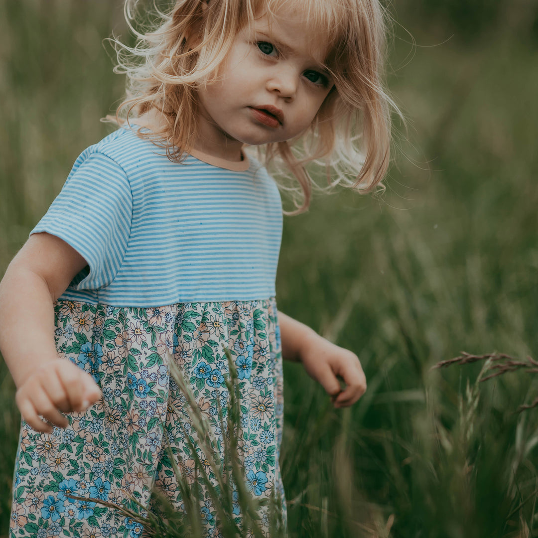 Toddler wearing stripe and floral dress